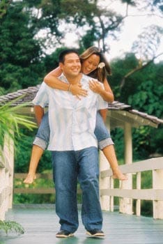 Fun Oahu Engagement couple photos Haiku Garden Kaneohe Hawaii