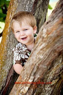 Child playing peek a boo at Waimanalo Beach Oahu Hawaii