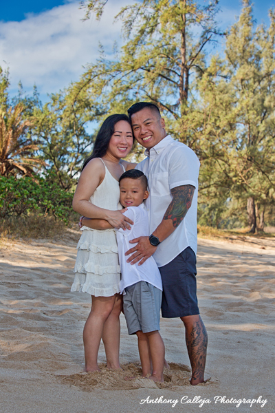 Papailoa Beach Oahu Family Photo Session Ton Family Hugging at Papailoa Beach North Shore Oahu