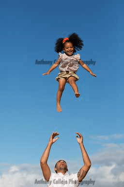 Kapolei Photographer Oahu Beach family photos of a father and daughter playing catchSecret beach Koolina Resort Oahu Hawaii